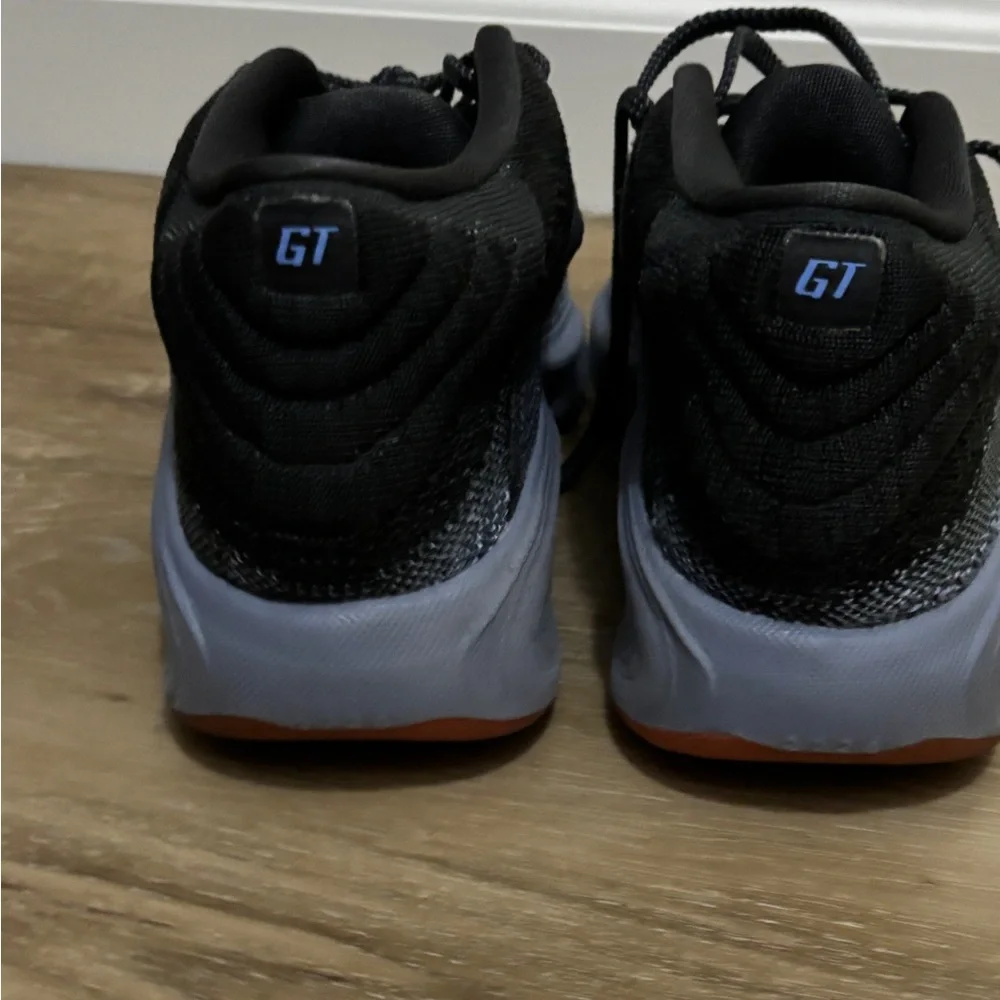 Nike Black Low-Top Sneakers with Orange & Gold Swoosh. Court shoes.